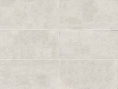 a white tile floor with four squares in the middle