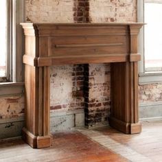 an old brick fireplace in a room