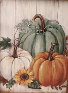 a painting of pumpkins and sunflowers painted on wood