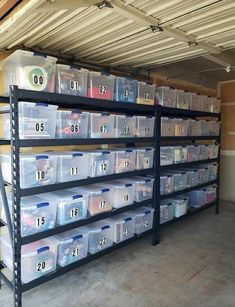 the shelves are filled with plastic containers and bins for various things to be stored