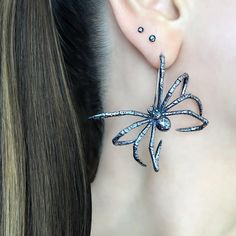 Add a touch of spookiness to your style with these Hanging Spider earrings . These unique and large spider earrings are perfect for Goths and Halloween enthusiasts. Get ready to make a statement with these eerie accessories. Sold as Pair Material 316 Stainless steel Total length :41 mm Total width: 47 mm Listing for  pair of earrings only *RETURNS / REFUNDS * -If you would like to return you purchase , please contact us within 7 days of receiving your package and we will accept the return.Return will only be made to the product, and not the shipping cost.  -Buyer is  responsible for the return shipping costs . -All jewelry must be returned unworn and in their original condition . *LOST MAIL* Once the package is marked as DELIVERED by the post office, we are not responsible for misplaced or Edgy Pierced Halloween Earrings, Edgy Pierced Earrings For Halloween, Edgy Halloween Pierced Earrings, Edgy Handmade Earrings For Halloween, Edgy Handmade Halloween Earrings, Edgy Party Earrings With Ear Wire, Edgy Earrings With Ear Wire For Parties, Edgy Dangle Earrings For Halloween, Edgy Silver Earrings For Halloween