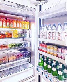 an open refrigerator filled with lots of drinks