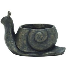 a ceramic snail shaped bowl with its tail curled up in the shape of a snail