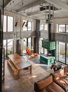 a living room filled with furniture and lots of windows