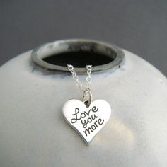 "sterling silver love you more necklace - A small solid sterling silver heart pendant, measuring just under 5/8\" (14 mm) across, 1/2\" (13 mm) down, a nice 16 gauge thick (1.2 mm). - Words are etched, so they are perfectly aligned. Details blackened (oxidized) to stand out. - Necklace is 1.5 mm sterling silver cable chain, length customizable at drop down menu. High quality lobster clasp and locking jump rings, all solid sterling silver. - Smooth on back, with a tiny 925 mark on back. - Package Everyday Meaningful Sterling Silver Charm Necklaces, Everyday Meaningful Sterling Silver Charm Necklace, Meaningful Sterling Silver Pendant Charm Necklace, Hand Stamped Heart Sterling Silver Charm Necklace, Meaningful Hand Stamped Sterling Silver Charm Necklaces, Sterling Silver Hand Stamped Heart Charm Necklace, Meaningful Hand Stamped Sterling Silver Charm Necklace, Sterling Silver Heart Charm Necklace, Meaningful Sterling Silver Charm Necklace For Mother's Day