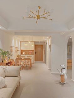 a living room filled with furniture and a white couch