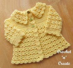 a crocheted baby sweater is shown with the words, crochet create