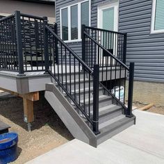 a metal stair railing on the side of a house