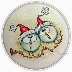 two birds wearing santa hats on top of each other