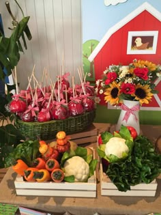 an assortment of fruits and vegetables on display at a farm fair or party with flowers in the background