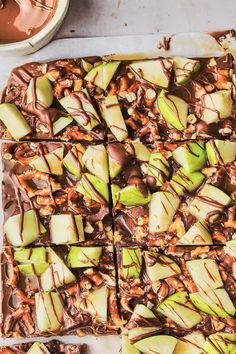 chocolate caramel apple slices on a baking sheet