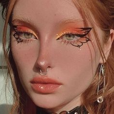 Red Butterfly Eye Makeup, Fairy Wing Eye Makeup, Eye Looks With Gems, Red Butterfly Makeup, Butterfly Tattoo Eye Makeup, Butterfly Tattoo Makeup, Monarch Makeup, Orange Makeup Aesthetic, Manhwa Makeup