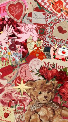 a teddy bear surrounded by valentine's day cards and other paper art work pieces