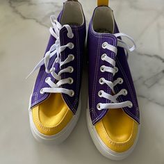 Never Worn New Yellow Canvas Shoes With Vulcanized Sole, Yellow Canvas Shoes With Rubber Sole, Purple Canvas Sneakers With Round Toe, Casual Low-top Sneakers With Yellow Stitching, Mustard Low-top Sneakers For Spring, Yellow Lace-up Canvas Sneakers, Yellow Canvas Sneakers With Round Toe, Yellow Canvas Sneakers For Spring, Yellow Canvas Low-top Sneakers