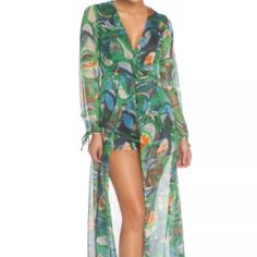 This Sassy Soft And Silky Maxi Romper Is A Multi Color Green Abstract Print That Has Long Sleeves, A Plunging V Neckline With A Very Fitted Waistline Attached Under Garment With A Sheer Bottom That Has A Opening In The Front. Maxi Romper Also Has A Keyhole With Button On The Back And Hidden Zipper On The Back. Note* - Romper Runs Small In The Waist, Garment Runs Small So Please Purchase A Size Up. Waist Measurements: Small 28" Inches & Medium 30" Inches Material: 100% Polyester Sheer Green Maxi Dress For Summer, Green Spring Cover-up For Beach Party, Summer Long Sleeve Party Cover-up, Summer Party Long Sleeve Cover-up, Long Sleeve Summer Party Cover-up, Summer Party Cover-up With Long Sleeves, Green Sheer Beach Dress, Spring One-piece Dress For Beach Party, One-piece Dress For Spring Beach Party