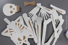 paper cut out of skeleton and bones on a table