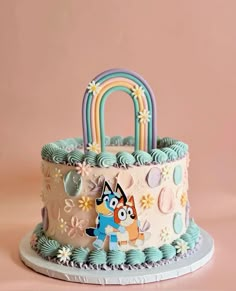 a cake decorated with an image of a cartoon character holding a bag on top of it