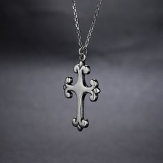 A deep and devoted connection to faith is something to honor. Express loyalty with a magnificent cross pendant. Although the design is straightforward, this pendant's elegance is unsurpassed.Material: Plating Color: Length: 450 mm Silver Cross Necklace With Clavicle Chain, Stainless Steel Cross Necklace With Clavicle Chain, Elegant Stainless Steel Cross Pendant Jewelry, Classic Sterling Silver Cross Charm, Classic Cross Pendant Necklace As Gift, Sterling Silver Cross Necklace With Clavicle Chain, Elegant Sterling Silver Crucifix Necklace, Spiritual White Gold Cross Pendant Necklace, White Gold Cross Necklace With Clavicle Chain