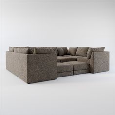 a large sectional couch sitting on top of a white floor