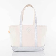 This Metallic Silver Medium Boat Tote bag is most commonly used as a beach bag, and is also the perfect size for a day trip to the to the park, beach, or on the boat when you need to tote a lot of stuff but don't want to be weighed down. Featuring a contrasting trim and a top zip closure, this bag also comes includes a nice outer pocket for easy access to smaller items such as a phone. Don't let It's name fool you - this classic bag features a timeless design making it a adorable gift bag or eve Hot Pink Clutch, Pink Clutch Bag, Baby Shower Gift Bags, Boat Tote, Greenville Nc, Pink Clutch, Monogram Handbag, Zipper Tote Bag, Classic Bags