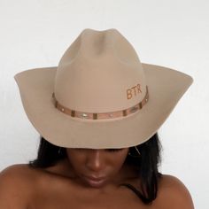 The Upland Western Cowboy Hat seamlessly blends the rustic charm of the Wild West with a dash of futuristic boho flair. With its distinctive cowboy silhouette, complete with a cattleman creased crown and a stylish upturned brim, this hat exudes classic Texan allure. The leather band is adorned with gleaming silver jewels, adding a contemporary twist to this timeless fashion statement. Handcrafted and meticulously embroidered with the initials "BTR," this hat exemplifies the perfect fusion of tra Rigid Hat With Curved Brim For Western-themed Events, Rigid Curved Brim Hat For Western-themed Events, Western Hats For Ranch, Fitted Wide Brim Western Hats, Western Wide Brim Fitted Hats, Country Style Hat With Flat Brim For Ranch, Country Style Flat Brim Hat For Ranch, Country Style Fall Rodeo Hat, Southwestern Wide Brim Felt Hat For Western-themed Events