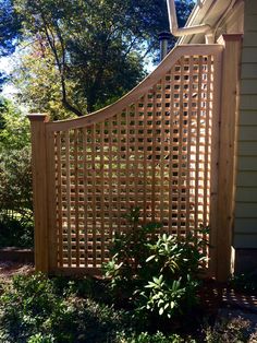 a wooden fence in front of a house