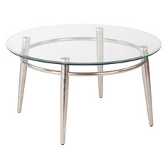 a round glass table with metal legs