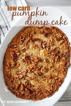 a close up of a cake in a pan on a table with the words low carb pumpkin dump cake