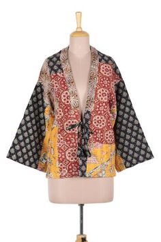 A mixed-print patchwork and kantha embroidery lend a wonderfully bohemian attitude to this kimono-style jacket. Crafted of all cotton the jacket features a front tie and flared sleeves. Designer Jay Kumar Maheshwari presents the jacket which is crafted by local artisans in Jaipur India. Patterned Patchwork Outerwear For Fall, Fall Boho Print Kimono, Spring Outerwear With Patchwork And Kimono Sleeves, Bohemian Multicolor Floral Print Outerwear, Bohemian Long-sleeved Floral Patchwork Outerwear, Bohemian Long Sleeve Outerwear With Floral Patchwork, Multicolor Patchwork Outerwear With Kimono Sleeves, Multicolor Patchwork Kimono For Spring, Casual Multicolor Patchwork Kimono