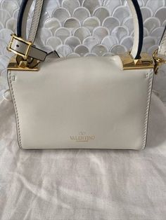 Valentino Garavani Rockstud Mini Ivory Tan Leather Top Handle Shoulder Bag | eBay White Top Handle Shoulder Bag With Metal Hardware, White Leather Satchel With Metal Hardware, White Satchel With Branded Hardware For Evening, Designer White Bags With Metal Hardware, White Leather Bag With Metal Hardware, Luxury White Satchel With Metal Hardware, Designer Cream Shoulder Bag With Branded Hardware, Cream Shoulder Bag With Branded Hardware For Formal Occasions, Formal Cream Shoulder Bag With Branded Hardware