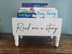 a book stand with books on it that says read me a story