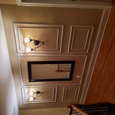 an overhead view of a hallway with lights on the ceiling and drawers in the wall