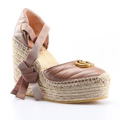 The Gucci Gg Matelasse Leather Platform Espadrilles In Rose Tan Is Crafted In Italy From Raffia And Smooth Leather. These Wedge Heels Feature A Zig Zag, Matelasse Pattern, Espadrille Sole With A Wedge Heel And Platform, Gg Logo At The Front And Tie Ankle Strap. Rose Tan Gg Matelasse Leather Platform Espadrilles Beige Heel 100% Leather Raffia Sole And Heel Wedge Heel Shoes Gg Logo Tie Ankle Strap Almond Shaped Toe Size 39.5 2.5" Platform 4.5" Heel Product Number 573023 Made In Spain Luxury Spring Platform Espadrilles, Gucci Espadrilles With Branded Insole, Chic Brown Flat Espadrilles, Chic Beige High Heel Espadrilles, Brown Gucci Heels For Summer, Luxury Gucci Espadrilles For Summer, Gucci Brown Summer Heels, Chic Gucci Espadrilles With Round Toe, Gucci Summer Closed Toe Espadrilles