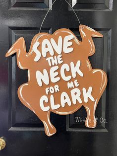 a door hanger that says save the neck for me clark