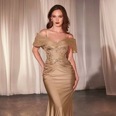 Indulge In Elegance With Our Fitted Satin And Lace Gown, Featuring A Luxurious Combination Of Fabrics That Exude Sophistication And Grace. The Off-The-Shoulder Accessory Adds A Touch Of Allure And Romance, Perfectly Framing Your Shoulders And Collarbone For A Breathtaking Look. This Gown Is Designed To Accentuate Your Curves With A Fitted Silhouette That Flatters Your Figure In All The Right Places. Fabric: Stretch Satin Length: Long Color: Gold Neckline: V-Neck Silhouette: Sheath Sleeve: Sleeve Gold And Champagne Mother Of Bride Gowns, Fitted V-neck Dress For Mother Of The Bride, V-neck Fitted Bodice Mother Of The Bride Evening Dress, Satin Mother Of The Bride Dresses, Unique Mother Of The Bride Dresses, Mom Of The Groom Dresses, Satin Ruched Dress, Shoulder Accessories, Gold Evening Gown