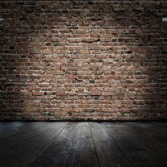 an old brick wall and wooden floor with light coming from the top, in front of it