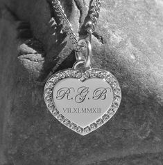 "This engraved silver rhinestone heart necklace pendant can be personalized on both sides of the heart pendant. These hearts have an elegant border with carefully placed cubic zirconia stones that will shine and glimmer. The silver stone heart can be engraved with a name or monogrammed initials. Each engraved heart includes a necklace[pictured] along with the pendant; custom sizes available. Silver Rhinestone Heart Necklace DIMENSIONS: .875\" wide x 875\" How To Send Engraving Instructions: When Custom Engraved Necklace, Heart Necklace Silver, Silver Heart Pendant, Silver Engraving, Rhinestone Heart, Engraved Necklace, Stone Heart, Silver Rhinestone, Heart Pendant Necklace