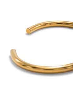 Adorn your wrist with a timeless classic: our Gold Tubular Cuff. Crafted from a solid brass core plated in luxurious 18K gold, this unisex cuff adds an elegant touch to any style. Large has a circumference of 6 3/4" Small has a circumference of 6" Timeless Classic, Rhodium Plated, Solid Brass, Cuff Bracelets, Cork, Gold Bracelet, 18k Gold, Plating, Cuff