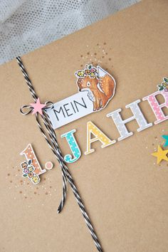 a card with the words men, happy birthday written on it and some paper decorations