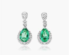 14K White Gold Regal Drop Emerald Earrings. An elegant and classic piece that will be passed down through generations. These vibrant elegant and diamond drop shaped earrings will elevate your evening look. Formal Pear-shaped Bridal Earrings, Classic White Gold Teardrop Earrings For Formal Occasion, Formal Teardrop Earrings In Brilliant Cut Fine Jewelry, Formal Fine Jewelry Teardrop Earrings With Brilliant Cut, Brilliant Cut Teardrop Earrings For Formal Events, Pear-shaped Halo Design Earrings For Formal Events, Pear-shaped Halo Design Earrings For Formal Occasions, Formal Pear-shaped Halo Design Earrings, Classic Teardrop Earrings With Halo Design