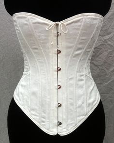 "This style corset eternally stylish, yet for the 1905 period enhances the signature s-curve shape of the era. It has a lower bust line, encourages the torso to tip forward, and has ¼\" spiral bones on the curved seams. The Mae exhibits the Art Nouveau style with its graceful curves. For the convenience of donning the corset by yourself, we have included a center front opening busk closure. Also available with no busk opening: https://www.etsy.com/listing/481708045/edwardian-corset-s-bend Availa Edwardian Corsets, Style Corset, Art Nouveau Style, Edwardian Era, Fashion Fabric, Corsets, Vest Dress, Bend, Strapless Top