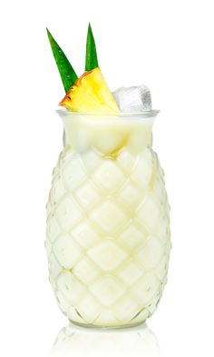 a pineapple drink in a glass filled with ice