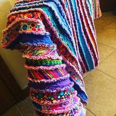 a multicolored blanket sitting on top of a counter