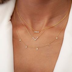 This 14k gold diamond baguette V necklace comes with 6 baguette diamond and 1 round diamond. Perfect gift for the bridal party, someone special, or yourself. Beautiful dainty piece to wear every or on special occasions. __________________________________________ M A T E R I A L & L E N G T H Available in 14k Yellow Gold, 14k Rose Gold, 14k White Gold Pendant: 13 mm x 0.4 mm (0.5 inch x 0.4 inch) Stone: 6 Natural Baguette Diamonds and 1 natural round diamond Diamond Size: 2.25 mm x 1.5 mm baguett Dainty Station Necklace With Diamond Accents For Anniversary, Dainty Station Necklace For Anniversary, Diamond Station Necklace Gift, Dainty Station Necklace With Single Cut Diamonds, Dainty Diamond Station Necklace, Baguette Diamond Necklace, Diamond Bar Necklace, Diamond Initial Necklace, Dainty Diamond Necklace