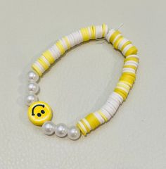 yellow smiley face clay bead bracelet Yellow Beaded Bracelets With Round Beads For Everyday, Yellow Round Bead Bracelets For Everyday, Yellow Round Beads Bracelet For Everyday, Yellow Beaded Bracelets For Everyday, Trendy Smiley Face Stretch Bracelet With Round Beads, Smiley Face Round Jewelry For Friendship, Trendy Stretch Bracelet With Smiley Face Round Beads, Casual Round Yellow Jewelry, Cute Yellow Jewelry With Letter Beads