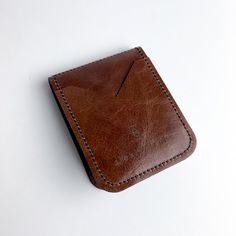 Our perfect Everyday wallet --- updated design with a few extra pockets. Carry cash + cards effortlessly with our very slim, single fold wallet. Classic Bifold Card Holder For Everyday Use, Classic Trifold Wallet With Card Slots For Everyday, Bifold Card Holder With Interior Slots, Classic Card Holder With Coin Pocket For Everyday Use, Classic Brown Card Holder With Phone Sleeve, Classic Bifold Wallet For Personal Use, Everyday Use Trifold Card Holder With Card Slots, Everyday Rectangular Wallets With Flat Pocket, Classic Bifold Card Holder With Flat Pocket