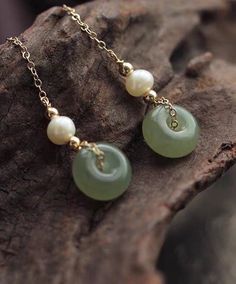 14K gold filled hetian jade donuts freshwater pearl clip-on long dangle earring. Comfortable Non pierced ear clip. gift for her Don't miss out on this timeless classic! The earring feature freshwater pearls and donuts shaped hetian jade in a clip on /ear stud design. The perfect comfortable design daily dressing. Styling tip: Perfect for everyday styling or special occasions. Product details: Sold as a pair. Materials: 14K gold filled Earring length: approx 6.5cm Hetian jade size: approx 1.0*0.5 Handcraft Earrings, Pebble Jewelry, Stud Design, Pierced Ear, Donut Shape, Hetian Jade, Long Dangle Earrings, Comfortable Design, Ear Stud