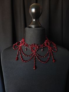 If you're looking for something very Unique and Unusual and would like to add an amazing look to your outfit then this Victorian Inspired neck accessory is for you. ❤Crystal beads, Japan beads. ❤Length: one size, fit any neck size. ❤Packaging: It is carefully shipped in a box with a velvet bag ❤This beauty can be made for you in any Crystal colors that fit your wedding or special outfit. Welcome to my shop  https://www.etsy.com/shop/JewelryFashionArt?ref=hdr_shop_menu Luxury Red Beaded Necklaces For Festive Occasions, Luxury Red Elegant Beaded Necklace, Fantasy Choker Necklace For Parties, Fantasy Party Choker Necklace, Fantasy Halloween Choker Necklace, Gothic Costume Choker Necklace, Handmade Vampire Style Party Necklace, Fantasy Red Jewelry For Party, Red Choker Necklace For Halloween