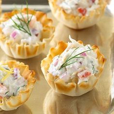 several small appetizers are sitting on a tray