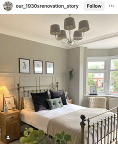 a bed room with a neatly made bed and two lamps on either side of the bed